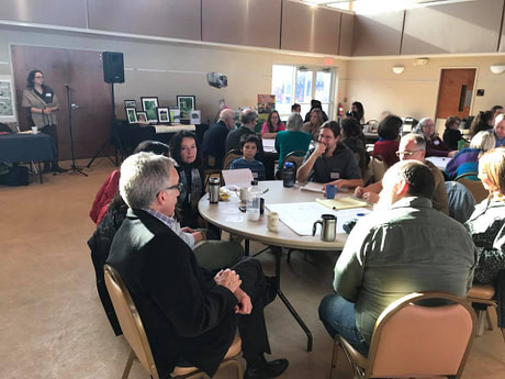 19961241_10159762889735262_3649245605044812408_n Rhonda Baird facilitating a large group workshop, 2018